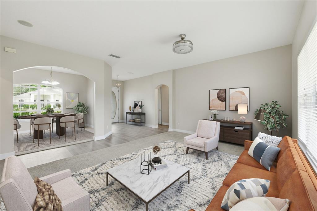 609 Renner Road Port Orange, FL 32127 - Photo 9 of 37 a living room with furniture and a table