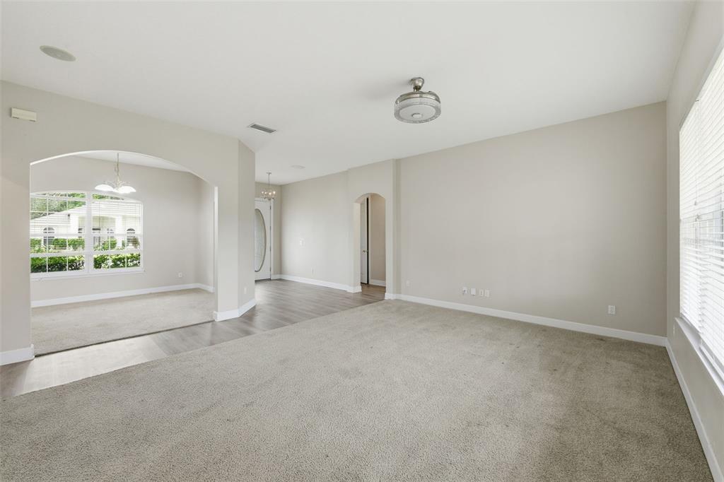 609 Renner Road Port Orange, FL 32127 - Photo 10 of 37 an empty room with a window and a ceiling fan