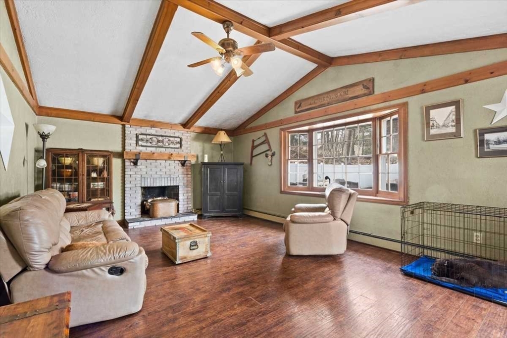 136 Winthrop Lane Holden, MA 01520 - Photo 12 of 42 a living room with furniture and a fireplace