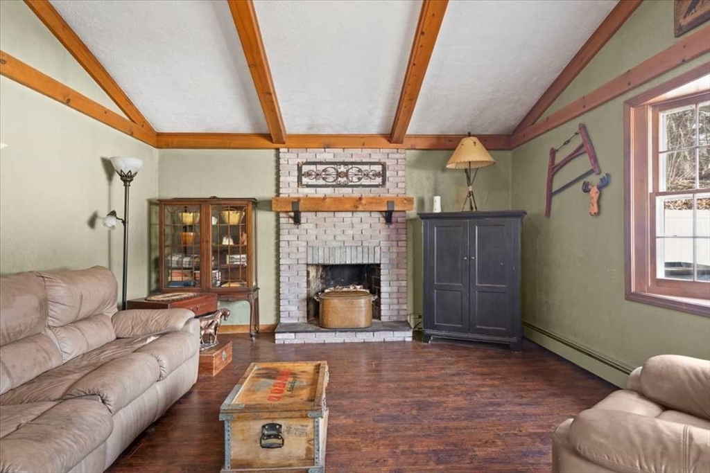 136 Winthrop Lane Holden, MA 01520 - Photo 14 of 42 a living room with furniture and a fireplace