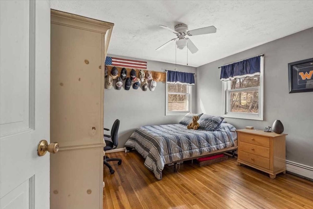 136 Winthrop Lane Holden, MA 01520 - Photo 25 of 42 a bedroom with a bed and windows