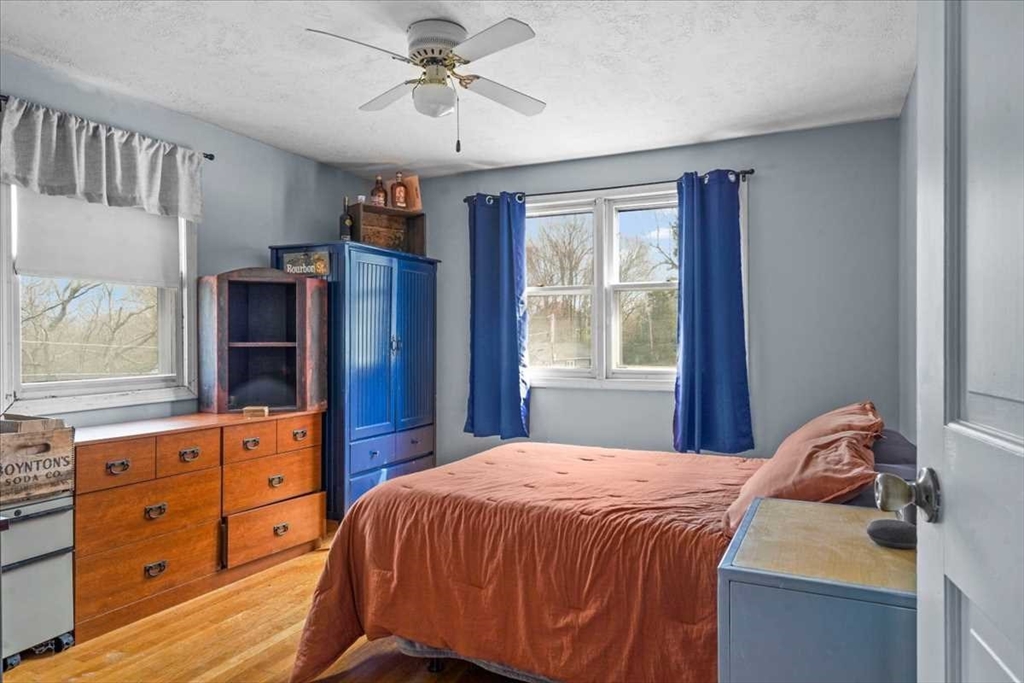 136 Winthrop Lane Holden, MA 01520 - Photo 28 of 42 a bedroom with a bed and a dresser