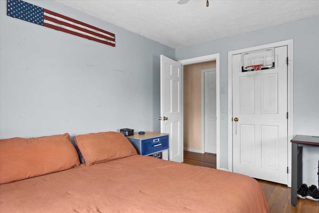 136 Winthrop Lane Holden, MA 01520 - Photo 29 of 42 a bedroom with a bed and a night stand