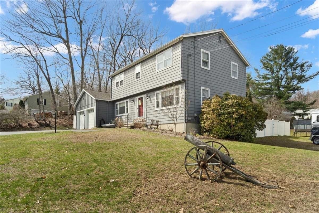 136 Winthrop Lane Holden, MA 01520 - Photo 3 of 42 a view of a house with a yard