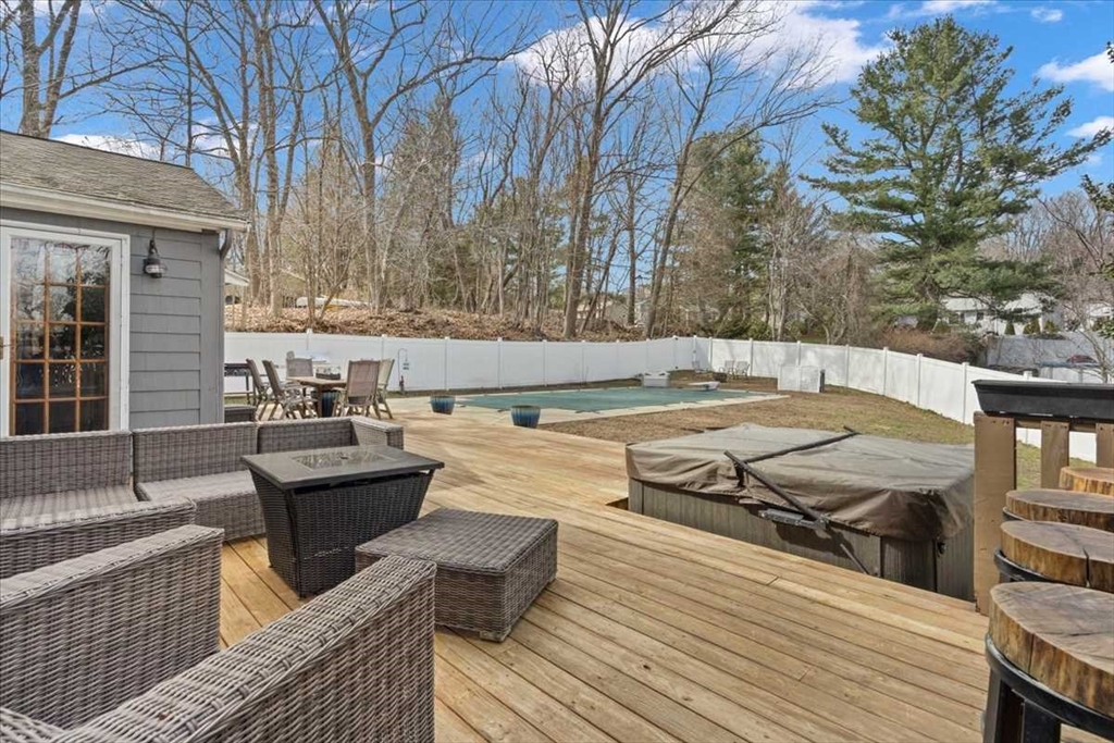 136 Winthrop Lane Holden, MA 01520 - Photo 31 of 42 a view of a roof deck with couches and wooden floor