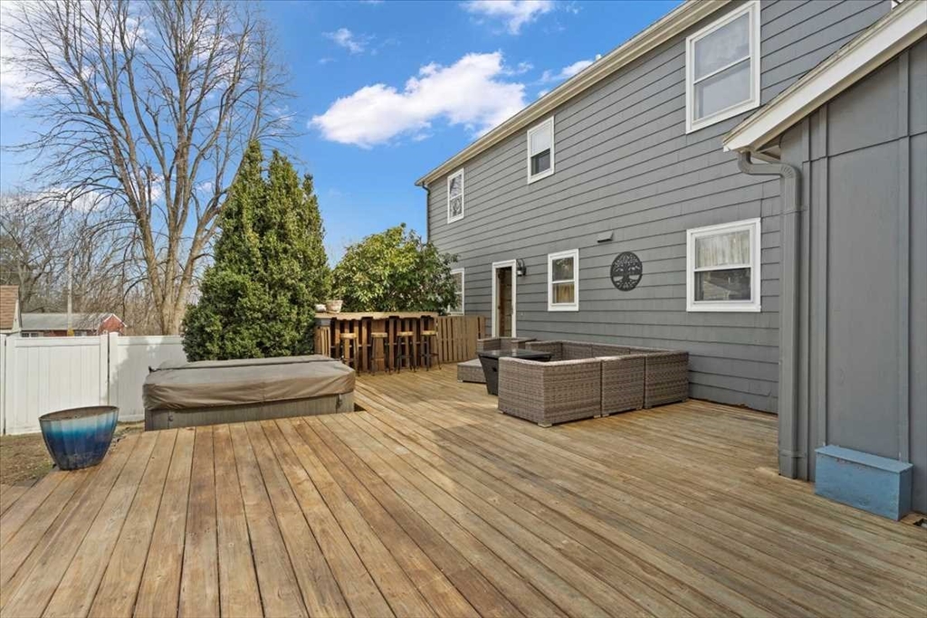 136 Winthrop Lane Holden, MA 01520 - Photo 35 of 42 a backyard of a house with wooden floor and outdoor seating