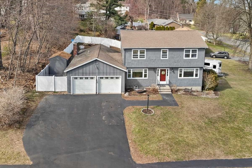 136 Winthrop Lane Holden, MA 01520 - Photo 5 of 42 a aerial view of a house with swimming pool