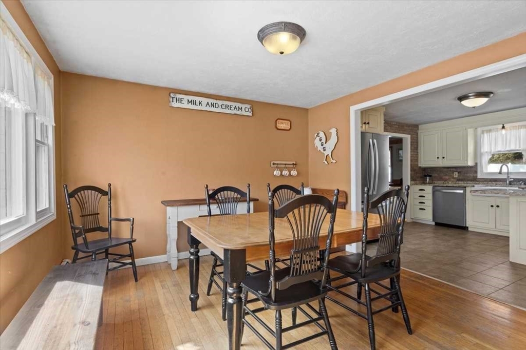 136 Winthrop Lane Holden, MA 01520 - Photo 10 of 42 a view of a dining room with furniture and wooden floor
