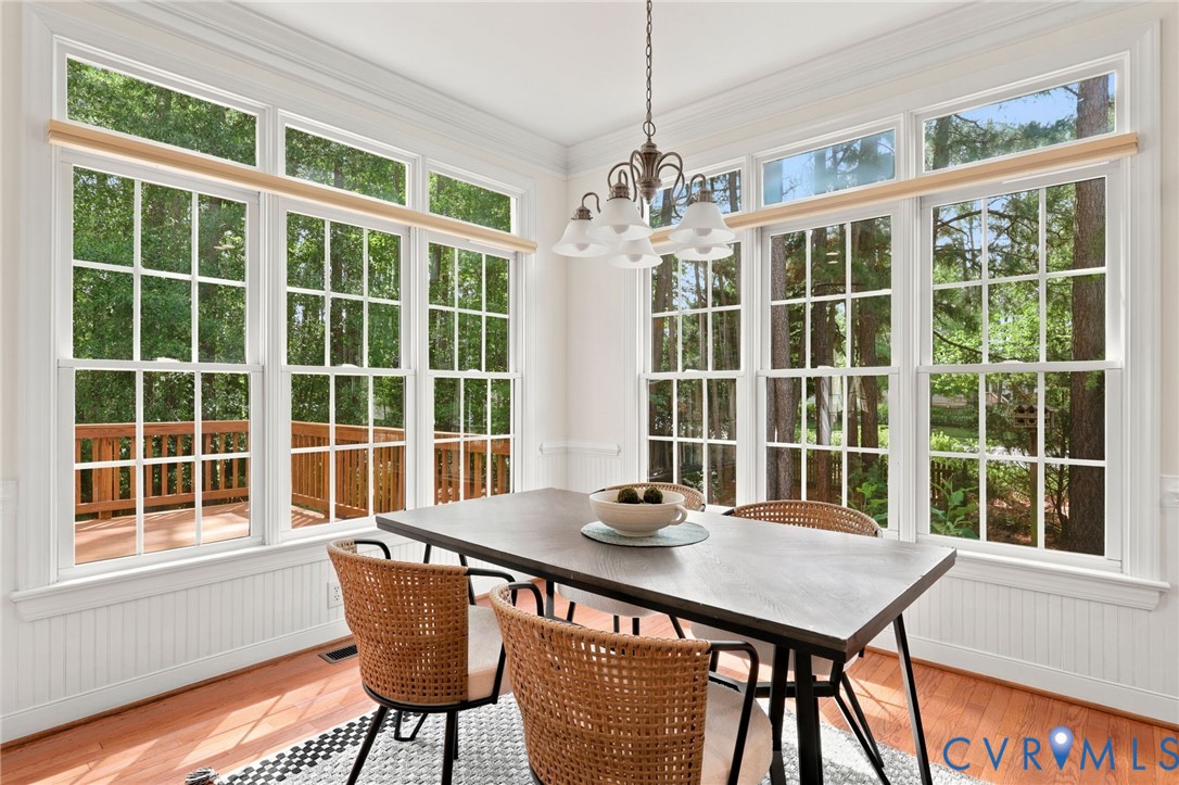 4701 Regal Oaks Road Glen Allen, VA 23059 - Photo 12 of 60 a dining room with furniture a rug and a large window