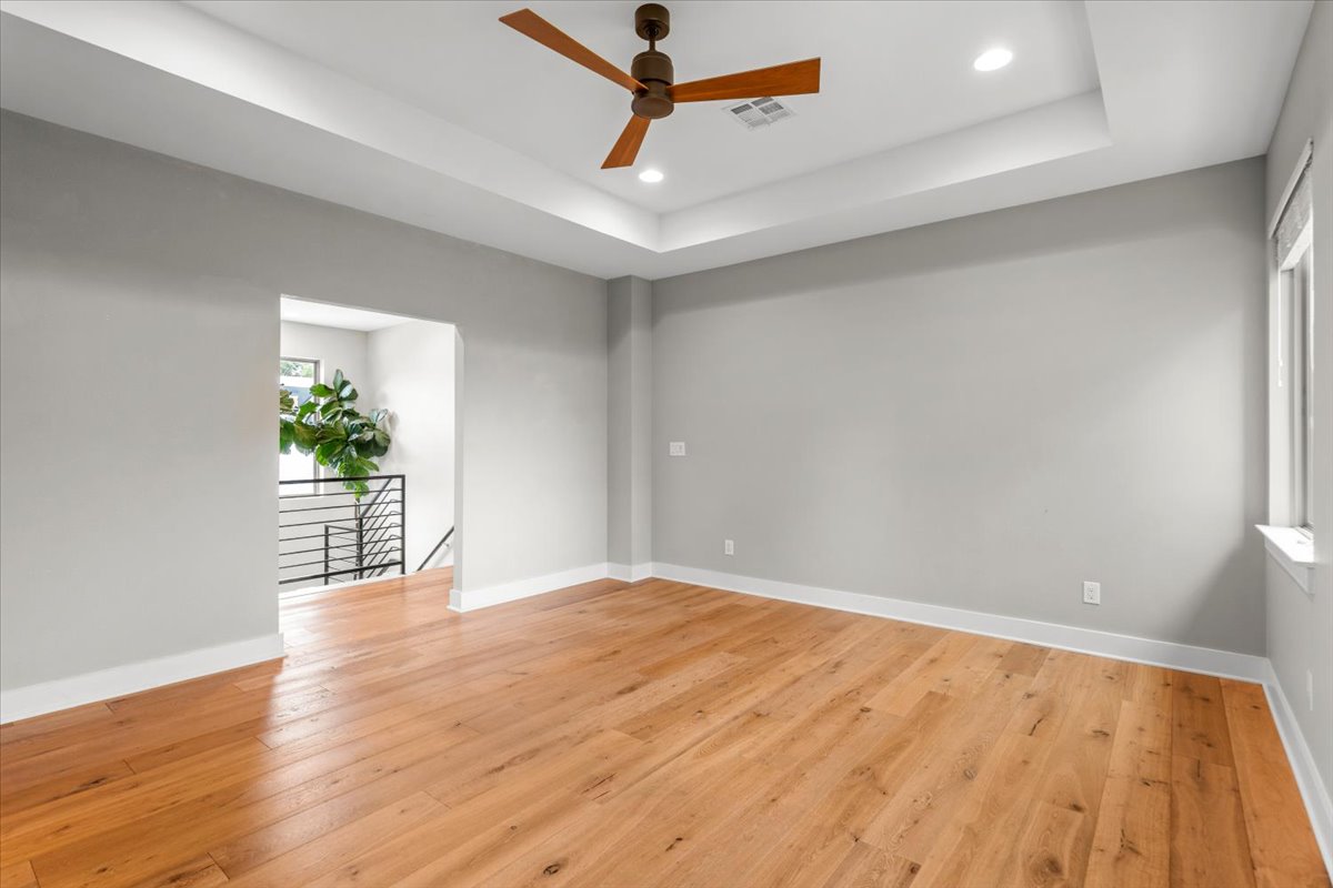 913 Stobaugh Street, Unit B Austin, TX 78757 - Photo 31 of 40 Natural light dances on polished hardwood floors in this generously sized, open concept living space.