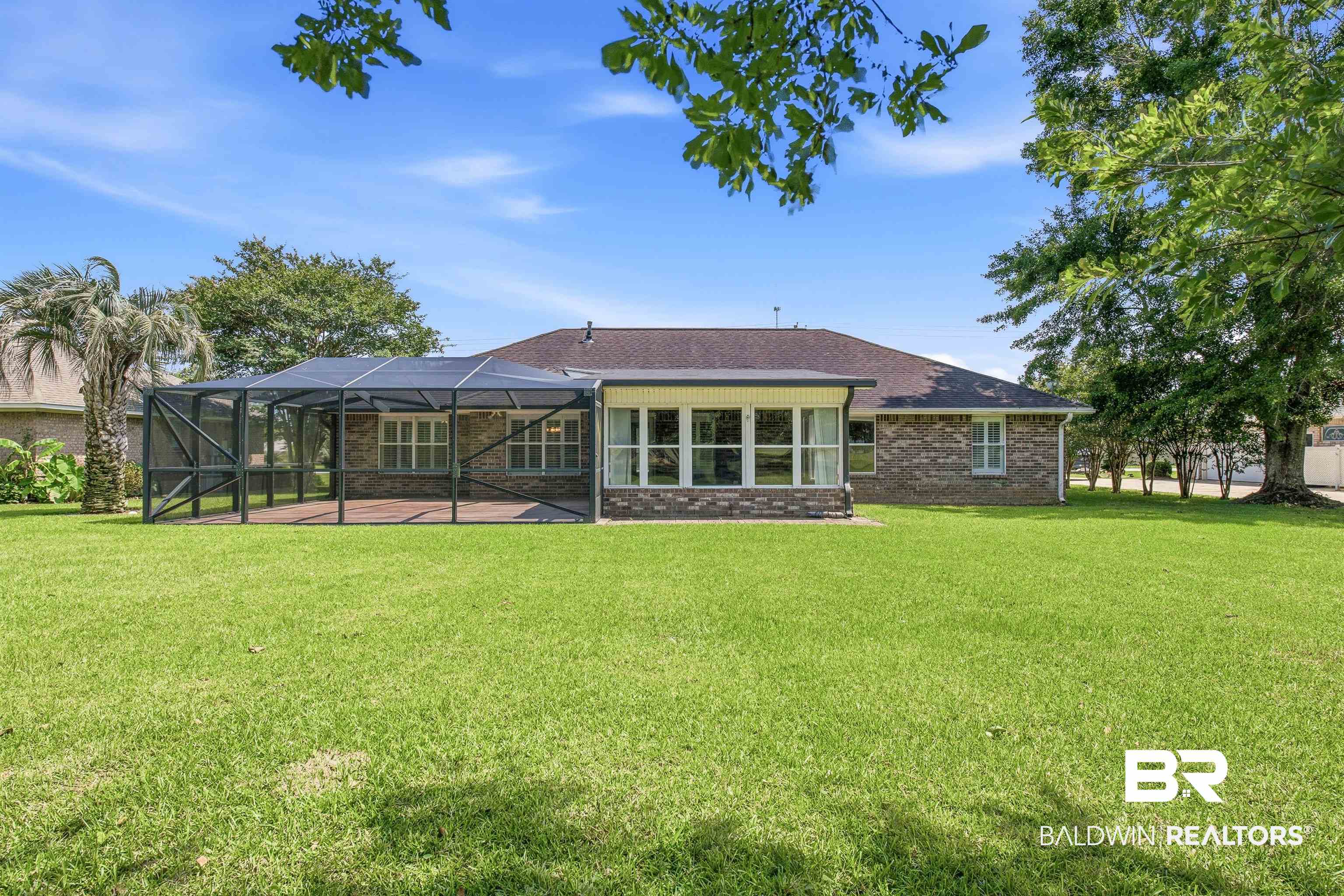 22685 County Road 12 Foley, AL 36535 - Photo 13 of 89 Spacious backyard featuring a screened patio area and a separate sunroom with multiple windows