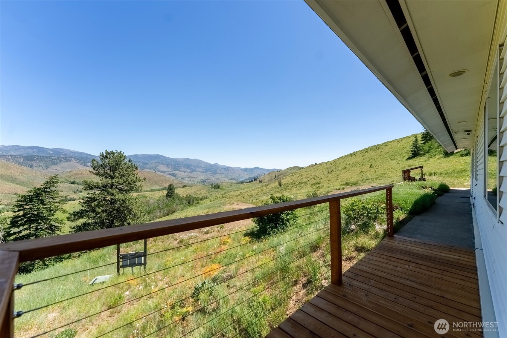 427 Rendezvous Road Winthrop, WA 98862 - Photo 9 of 40 a view of a balcony with wooden stairs