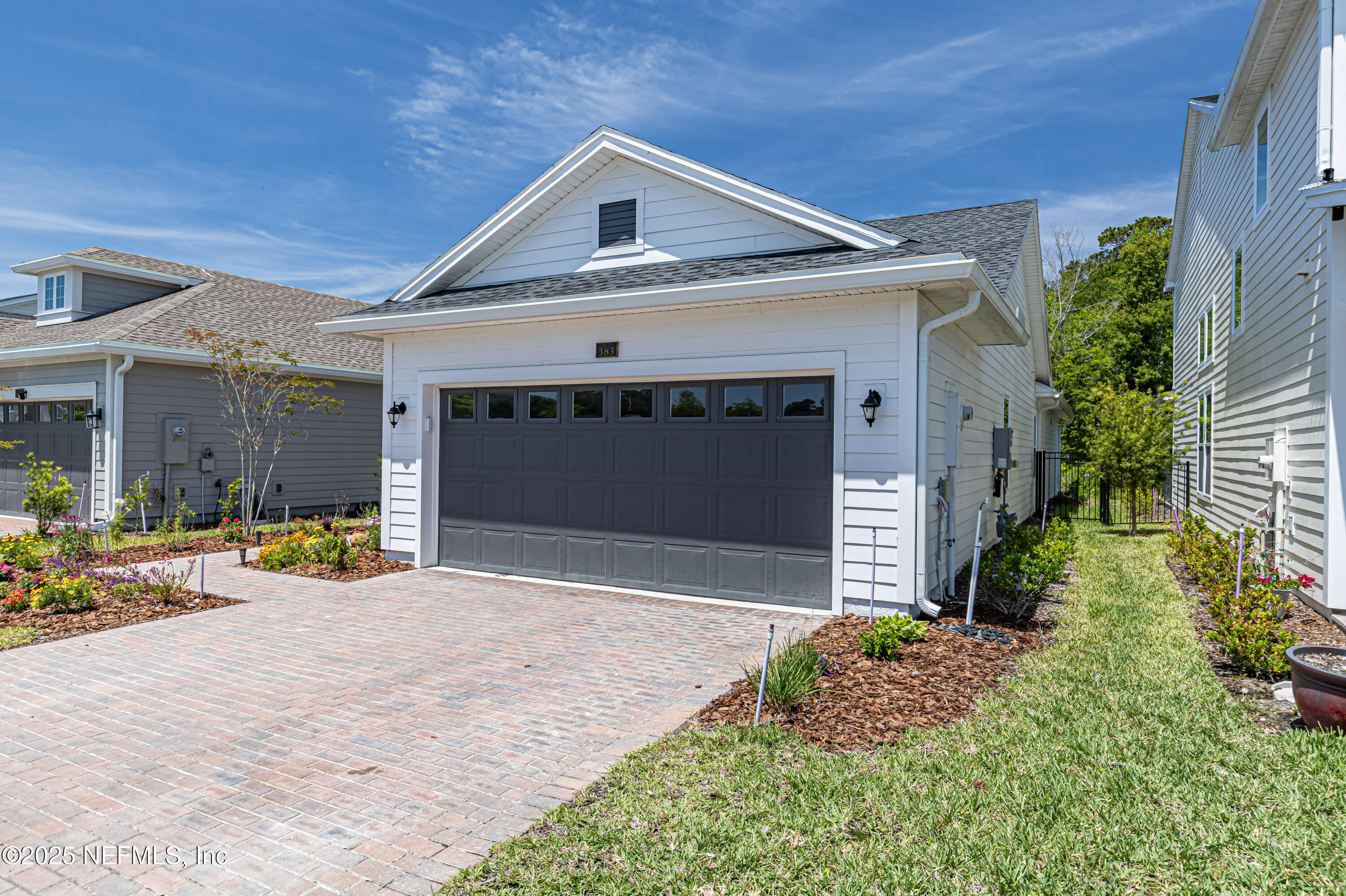 383 Windswept Way Street St. Augustine, FL 32092 - Photo 2 of 34 a front view of a house with garage