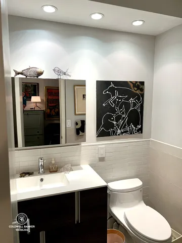 a view of storage and utility room with two washing machine