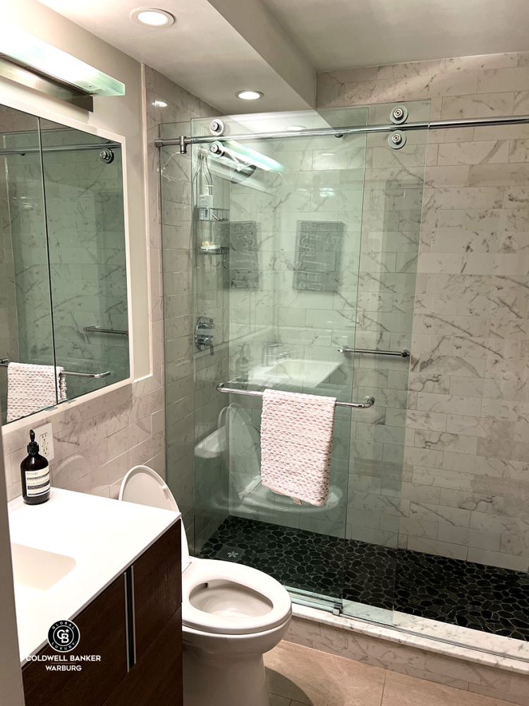 1065 Park Avenue, Unit 3B Manhattan, NY 10128 - Photo 17 of 18 a bathroom with a sink a toilet and shower