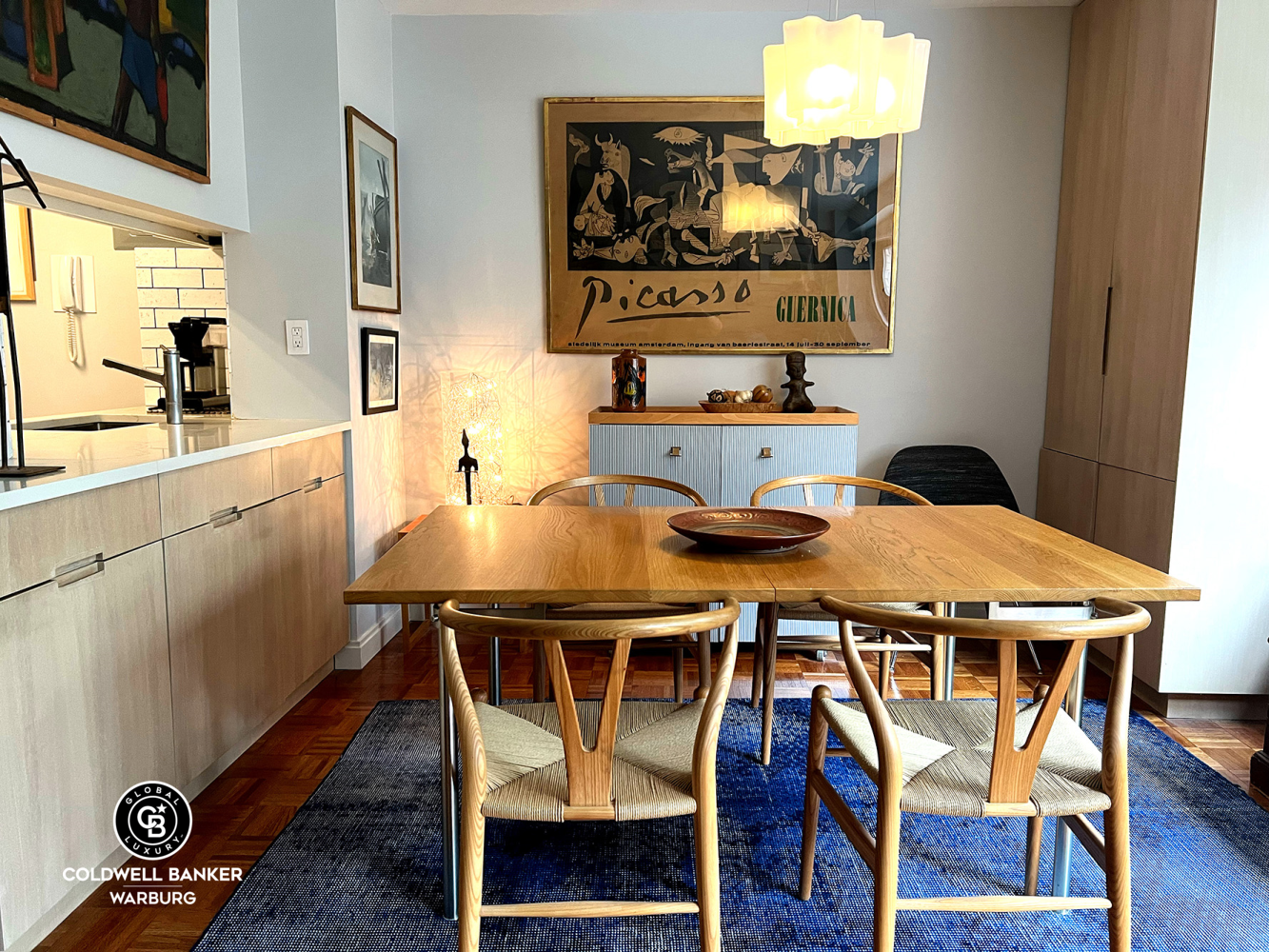 1065 Park Avenue, Unit 3B Manhattan, NY 10128 - Photo 3 of 18 a dining room with furniture and wooden floor
