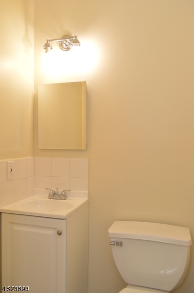 89 Forsythia Lane, Unit A Paramus, NJ 07652 - Photo 7 of 20 a bathroom with a sink and a mirror
