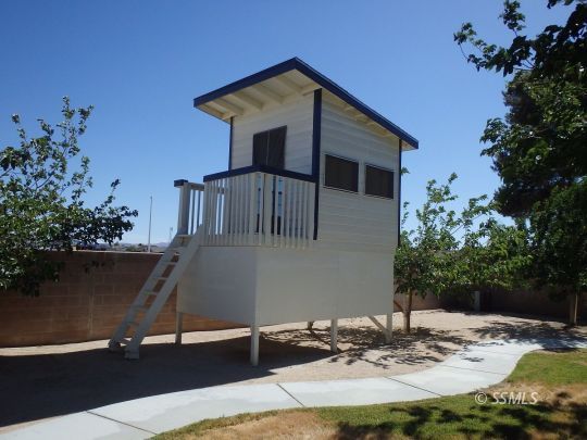 723 West Kevin Court Ridgecrest, CA 93555 - Photo 44 of 48 a front view of a house with swimming pool