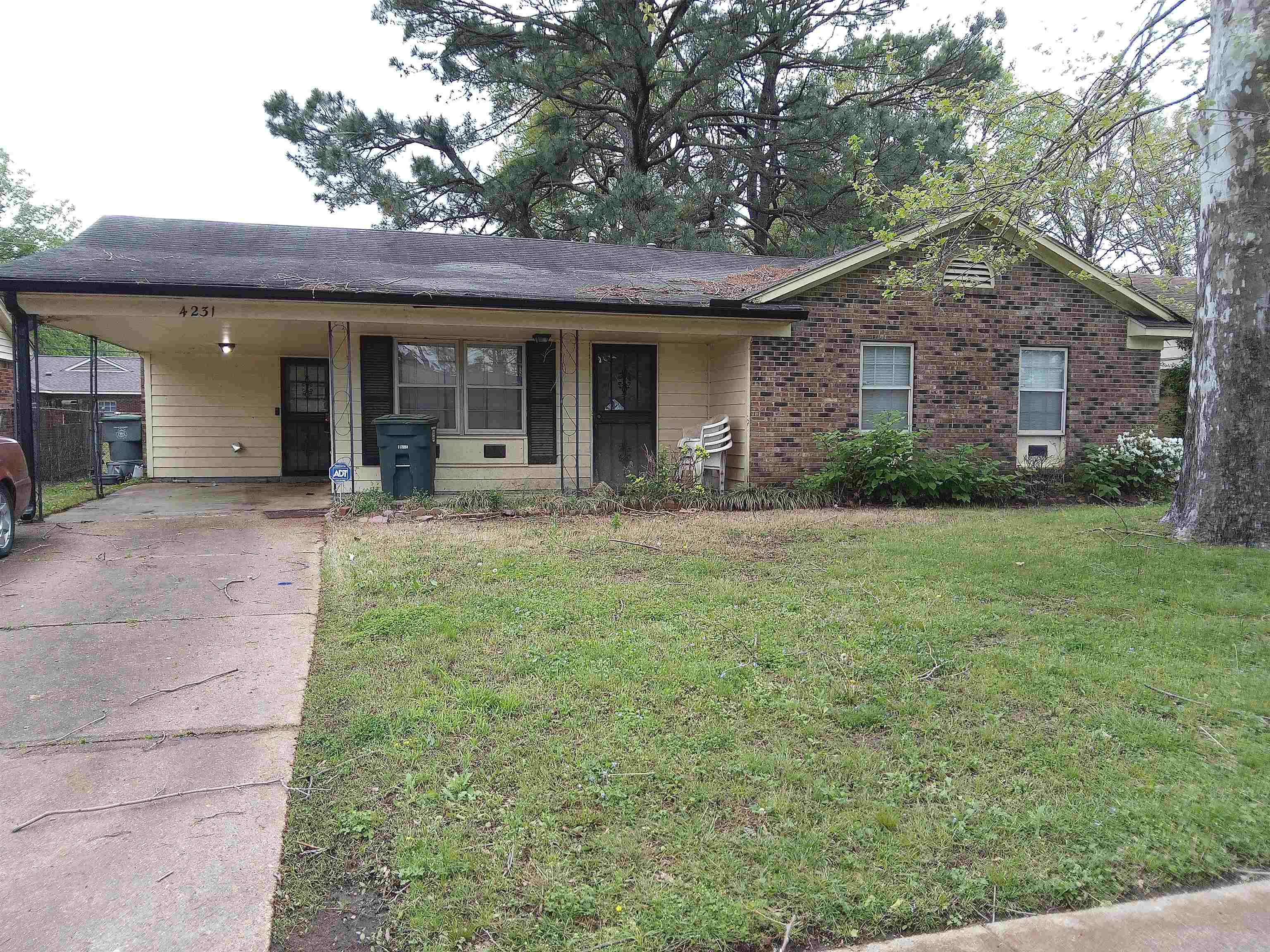 4231 Cochese Road Memphis, TN 38118 - Photo 1 of 1 Ranch-style house featuring driveway, a front yard, and a carport