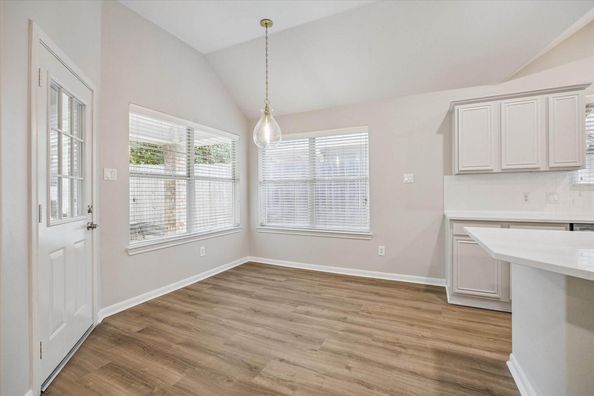 18747 Candle Park Drive Spring, TX 77388 - Photo 12 of 32 a view of an empty room with a window and wooden floor