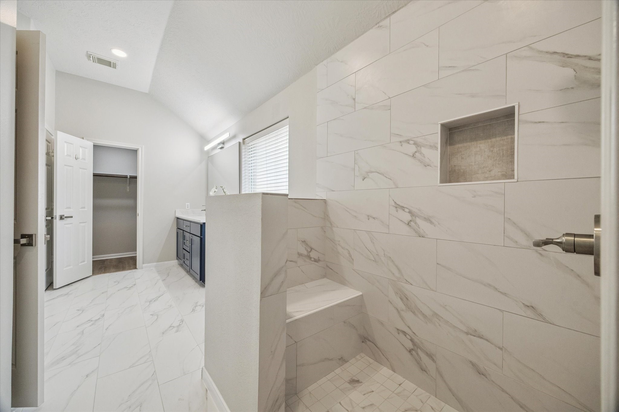 18747 Candle Park Drive Spring, TX 77388 - Photo 21 of 32 a bathroom with a bathtub and a shower