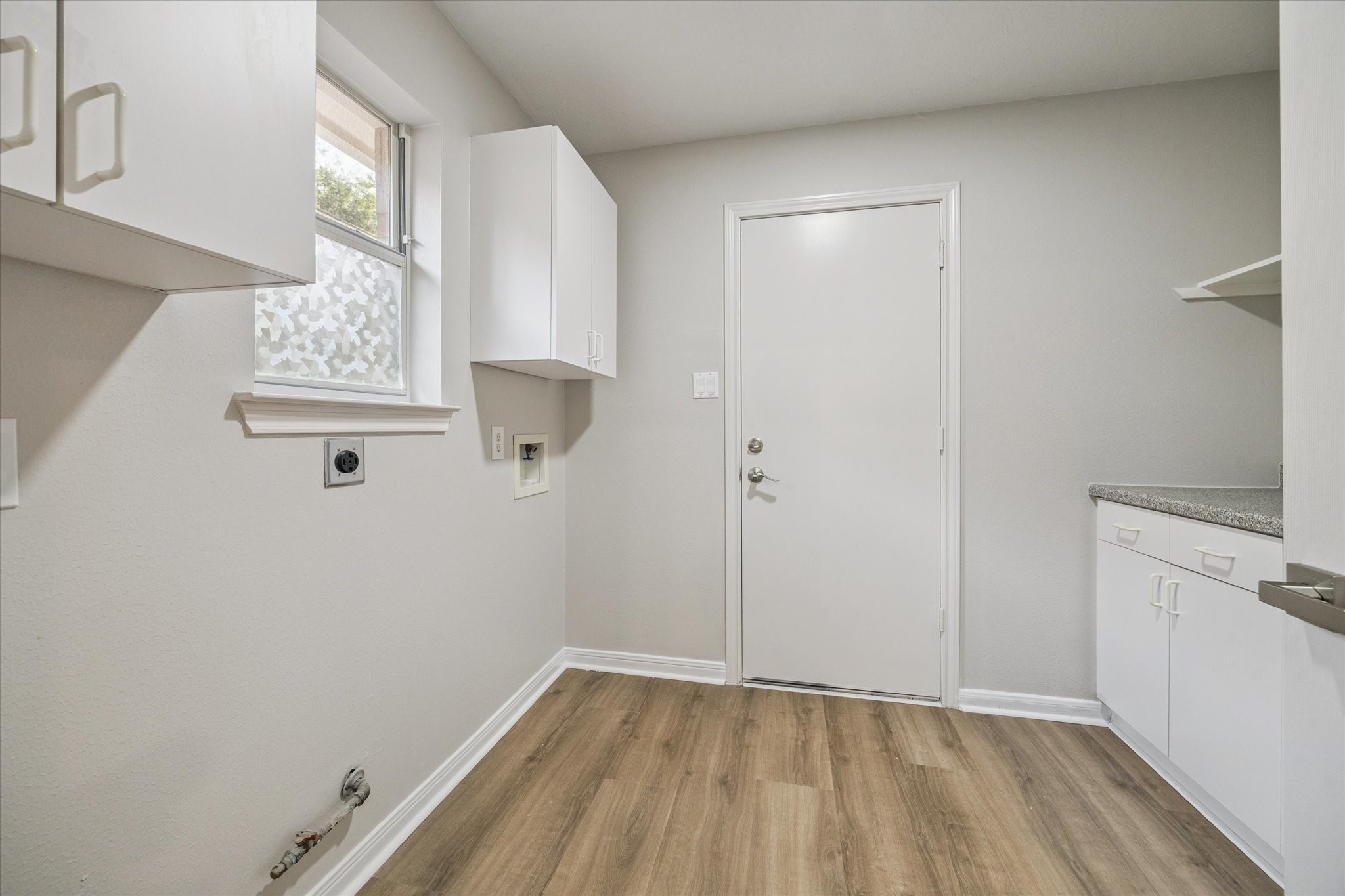 18747 Candle Park Drive Spring, TX 77388 - Photo 28 of 32 a view of hallway with a window and wooden floor