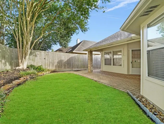 a view of a house with a garden