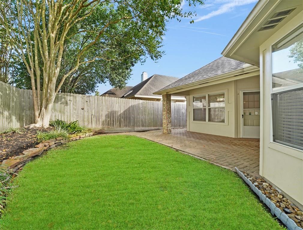 18747 Candle Park Drive Spring, TX 77388 - Photo 31 of 32 a view of a house with a garden