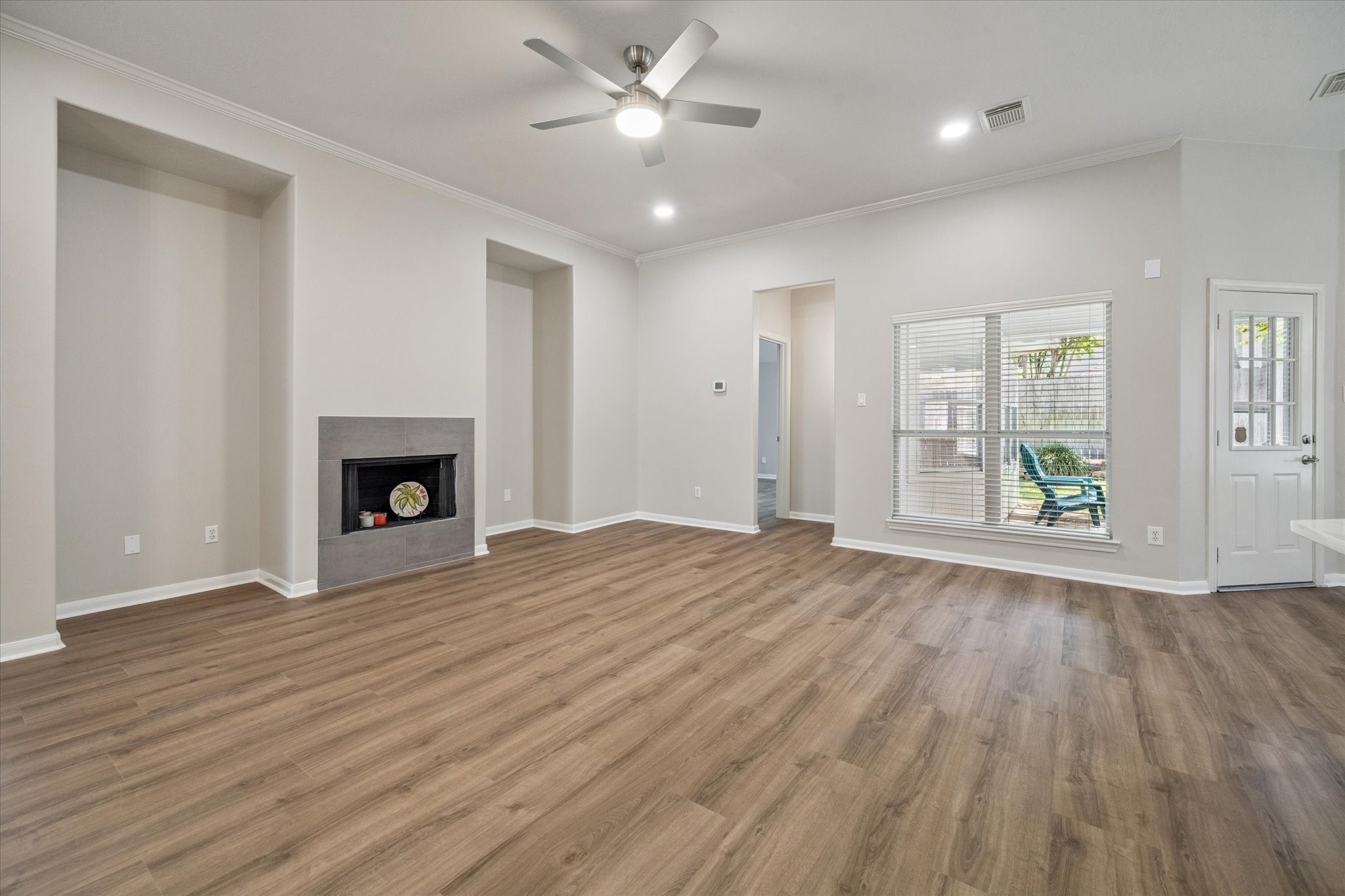18747 Candle Park Drive Spring, TX 77388 - Photo 9 of 32 a view of empty room with wooden floor and fan