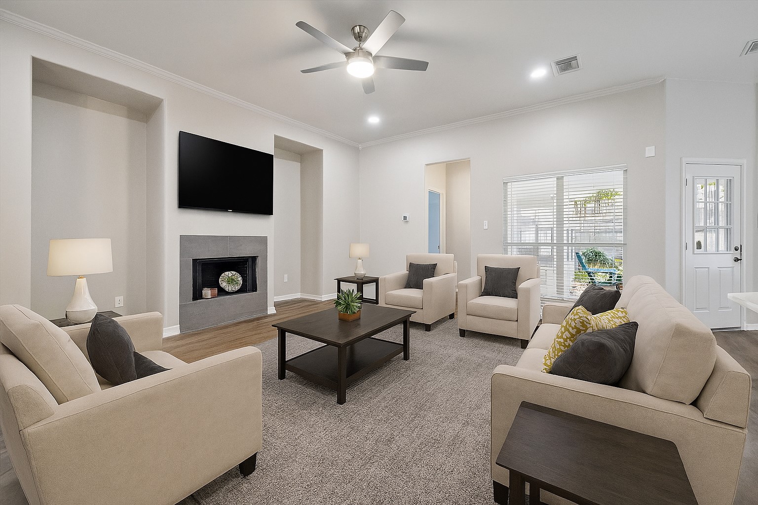 18747 Candle Park Drive Spring, TX 77388 - Photo 10 of 32 a living room with furniture a fireplace and a flat screen tv