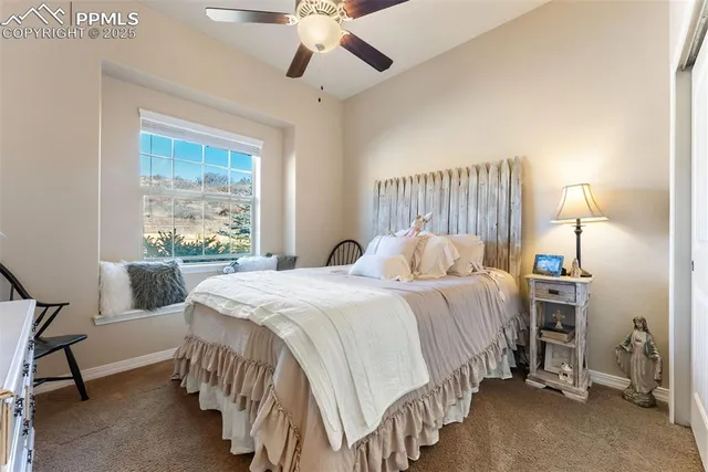 a bed room with a bed and a chandelier