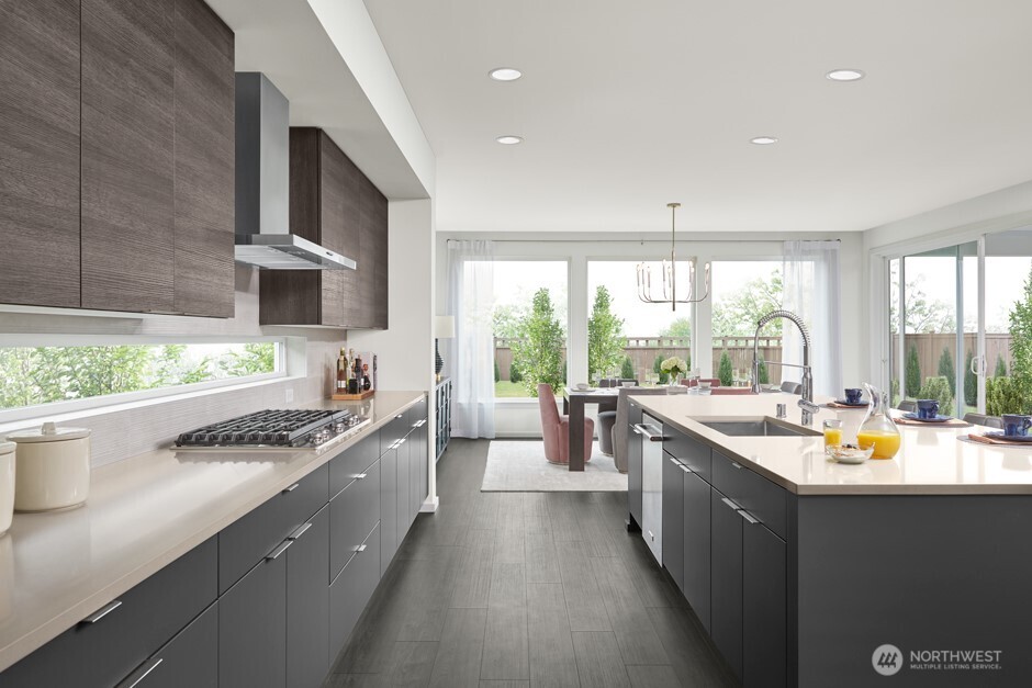 3916 199th Place Southeast Bothell, WA 98012 - Photo 6 of 11 a kitchen with stainless steel appliances a sink stove and cabinets
