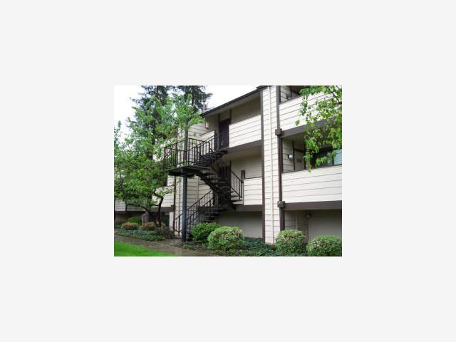 a picture of a bench in front of a building