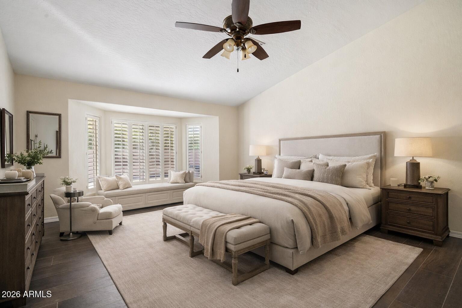 6303 West Melinda Lane Glendale, AZ 85308 - Photo 12 of 26 a spacious bedroom with a bed a couch and a chandelier