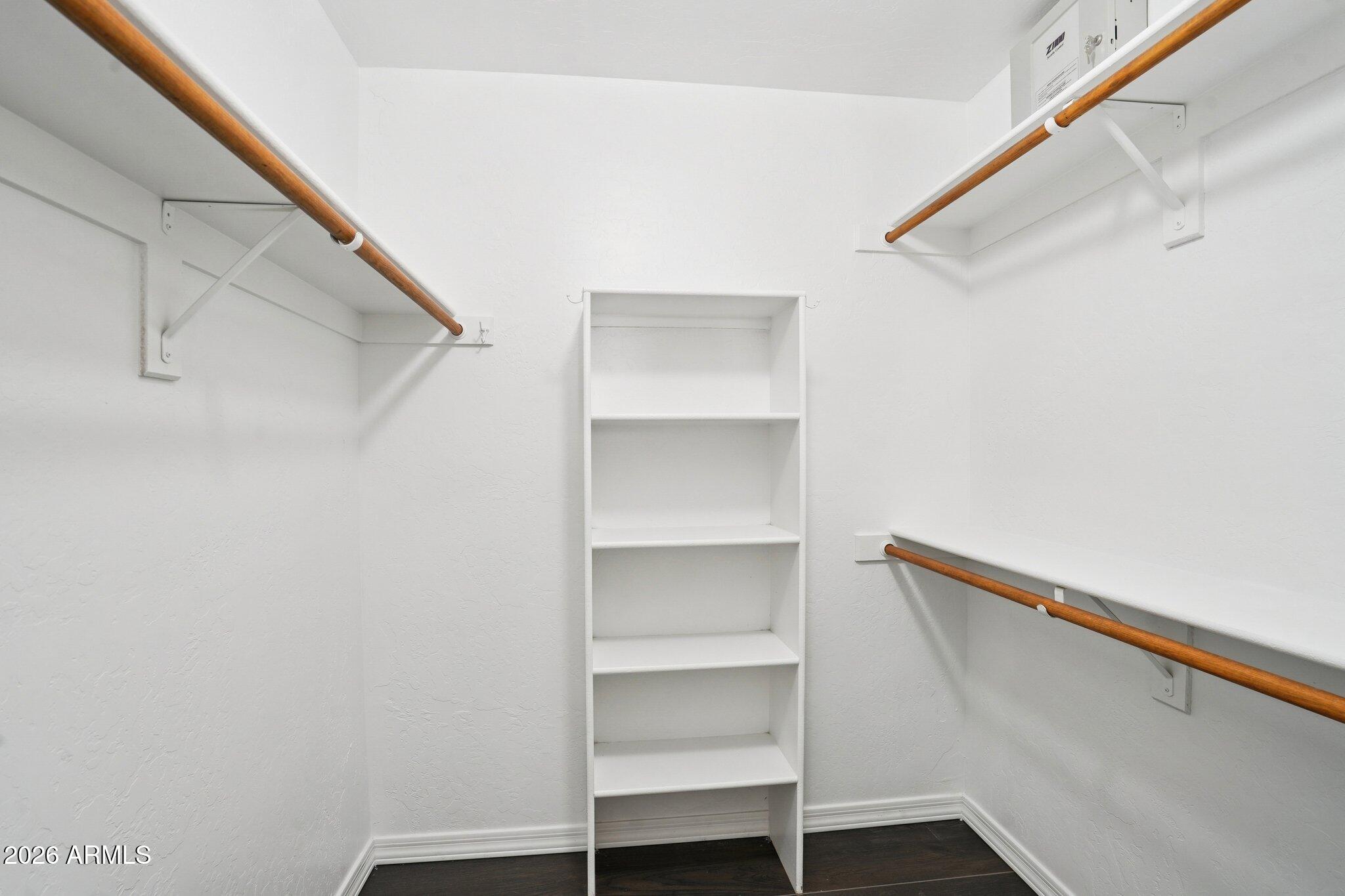 6303 West Melinda Lane Glendale, AZ 85308 - Photo 13 of 26 a view of walk in closet with empty racks