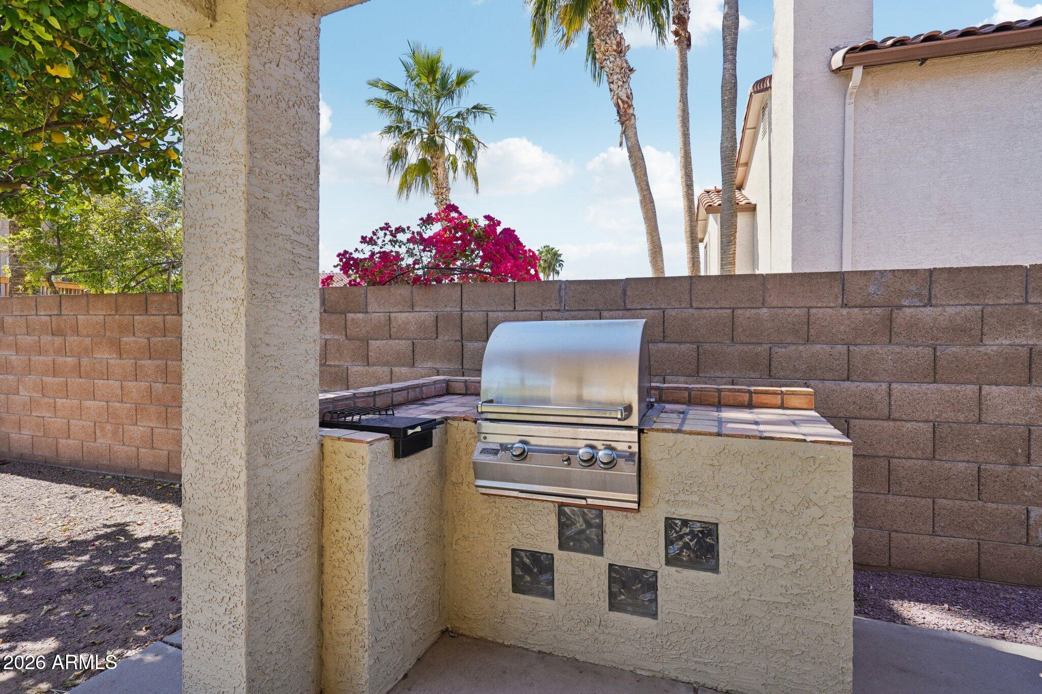 6303 West Melinda Lane Glendale, AZ 85308 - Photo 20 of 26 a kitchen with a stove and a potted plant