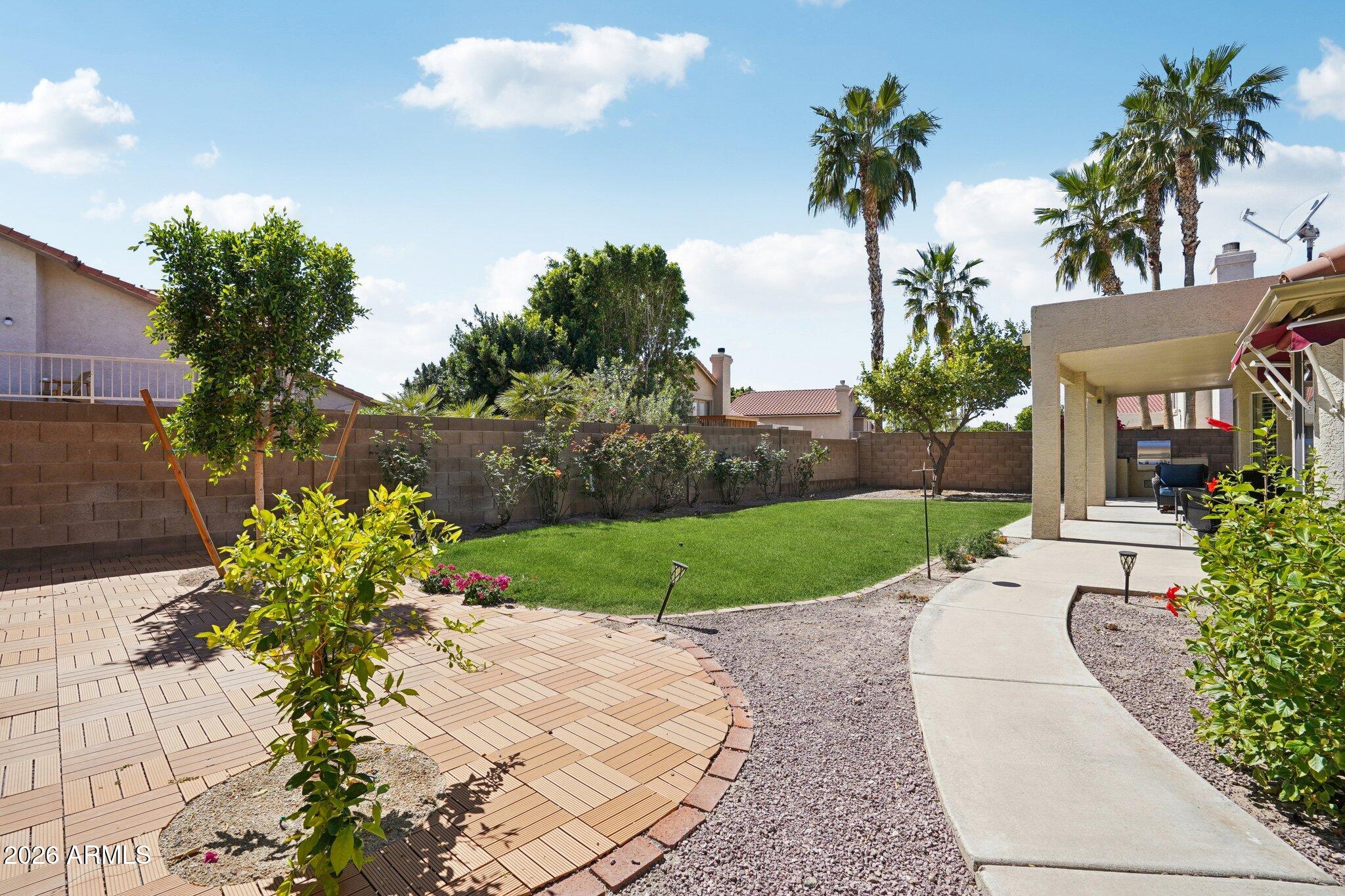 6303 West Melinda Lane Glendale, AZ 85308 - Photo 21 of 26 a view of a garden with a fountain