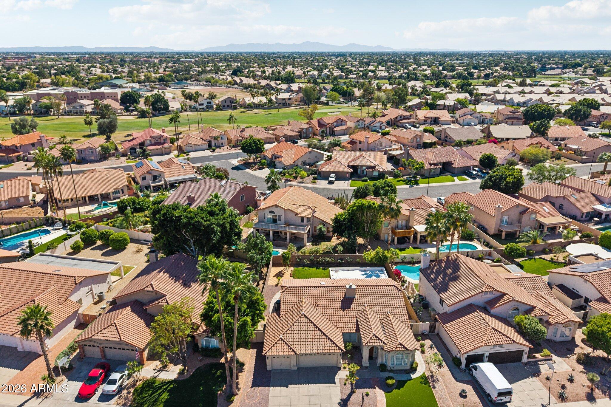 6303 West Melinda Lane Glendale, AZ 85308 - Photo 24 of 26 an aerial view of residential houses with outdoor space