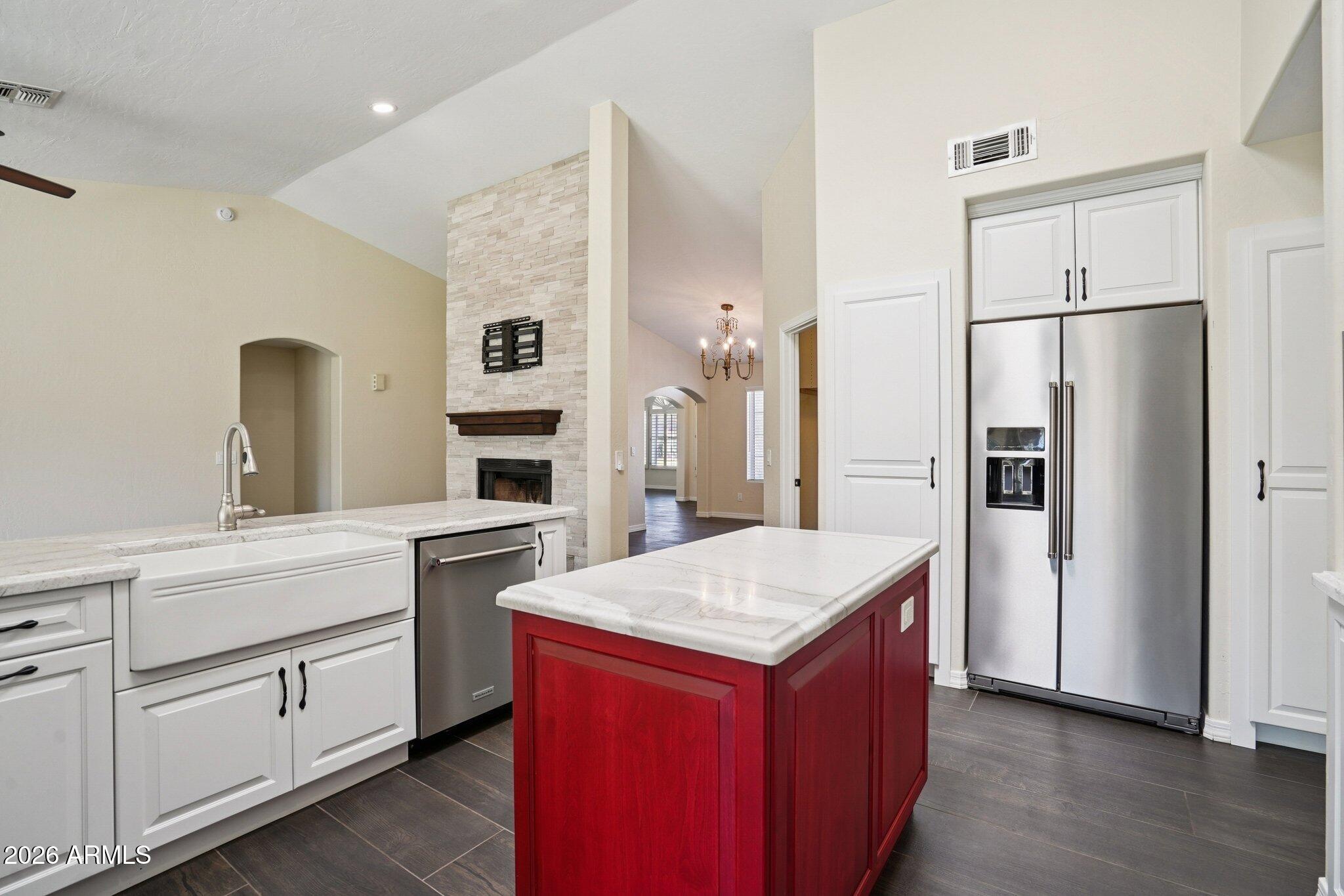6303 West Melinda Lane Glendale, AZ 85308 - Photo 6 of 26 a kitchen with a refrigerator sink and cabinets