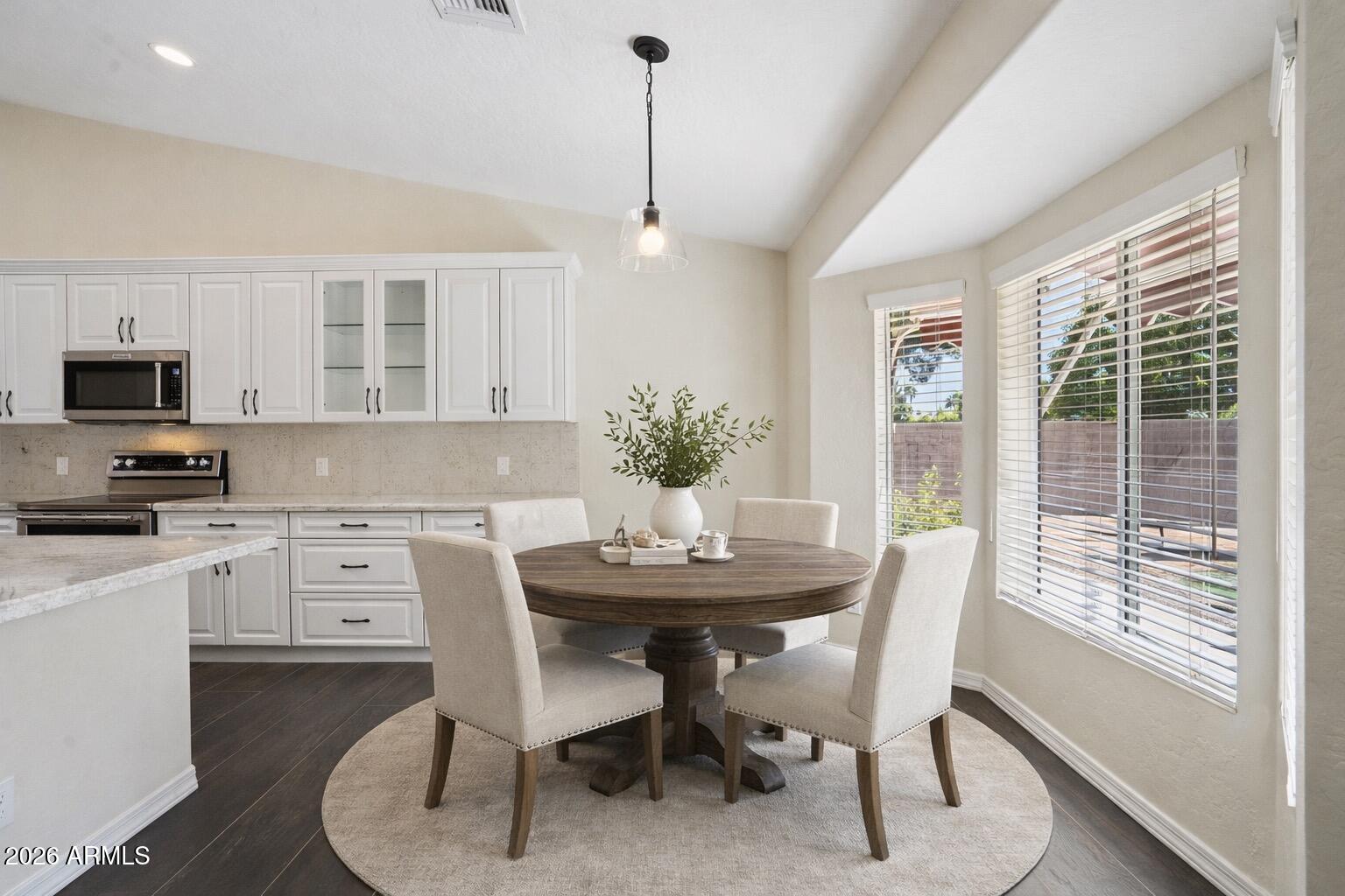 6303 West Melinda Lane Glendale, AZ 85308 - Photo 7 of 26 a view of a dining room with furniture window and outside view