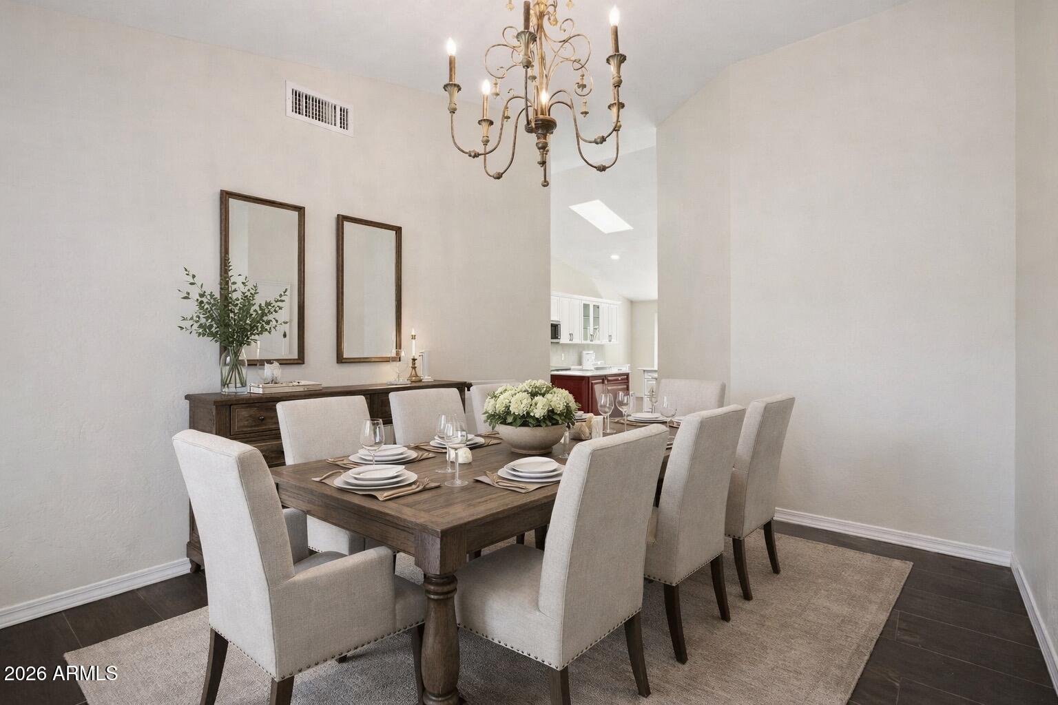 6303 West Melinda Lane Glendale, AZ 85308 - Photo 8 of 26 a view of a dining room with furniture and chandelier