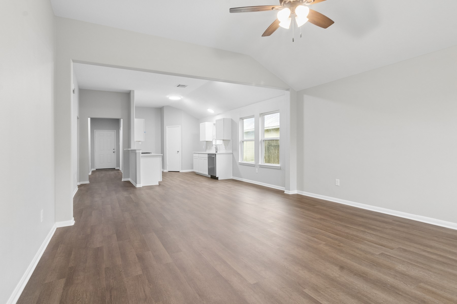 7811 Adonis Avenue Baytown, TX 77521 - Photo 13 of 36 wooden floor in an empty room with a window
