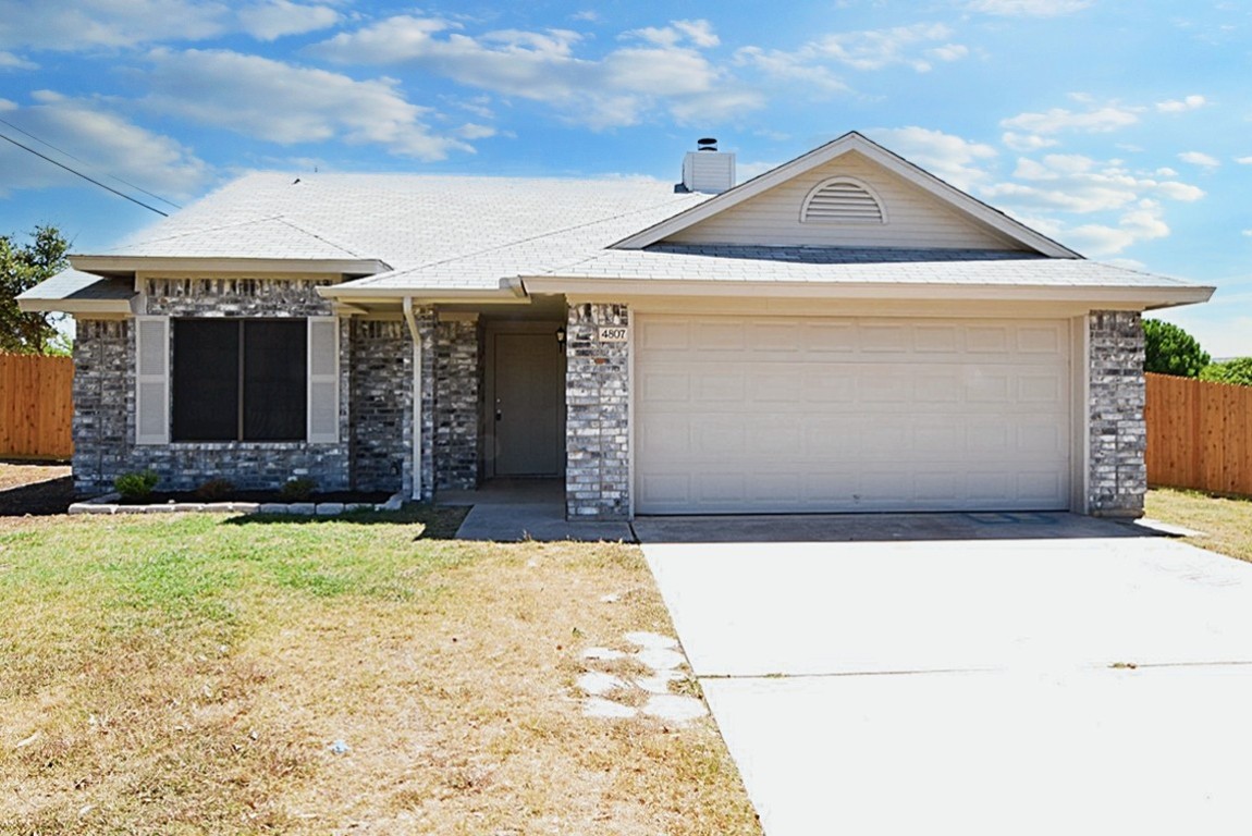 a front view of a house with garage