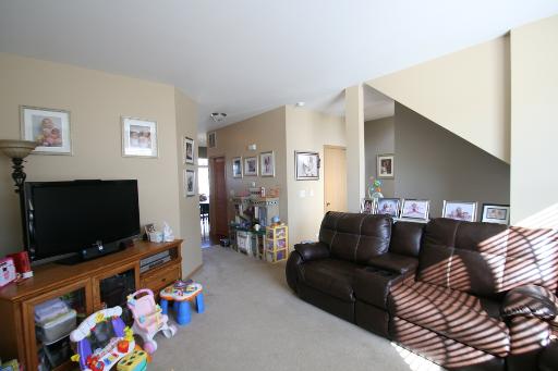 3843 Bailey Road Yorkville, IL 60560 - Photo 5 of 10 a living room with furniture and a flat screen tv