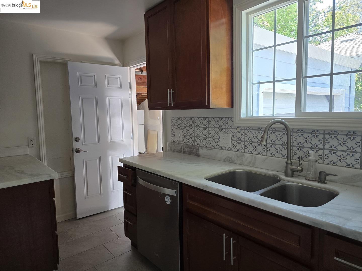 241 Humboldt Street San Rafael, CA 94901 - Photo 16 of 32 a kitchen with a sink and large window