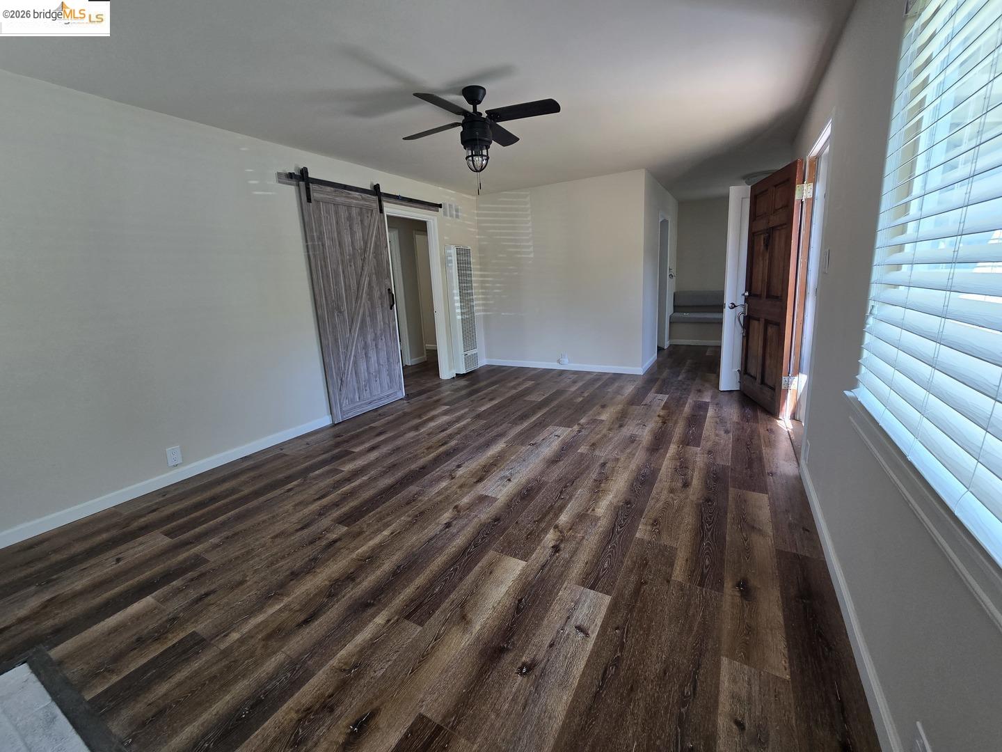241 Humboldt Street San Rafael, CA 94901 - Photo 17 of 32 a view of a hallway with wooden floor and a ceiling fan