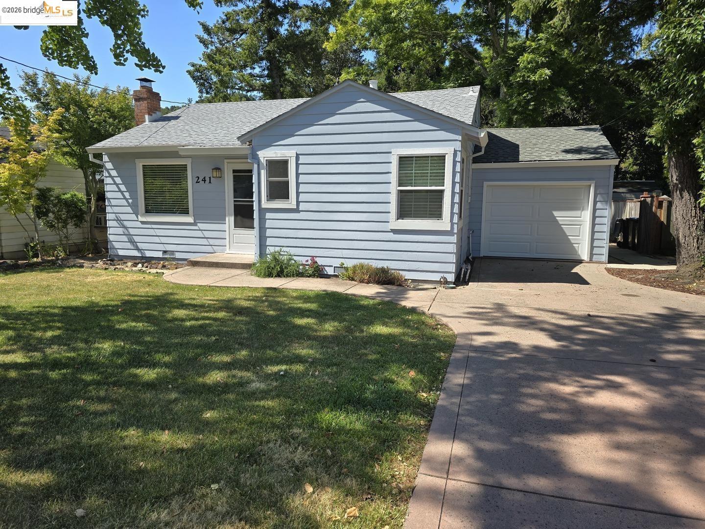 241 Humboldt Street San Rafael, CA 94901 - Photo 2 of 32 a front view of a house with a garden