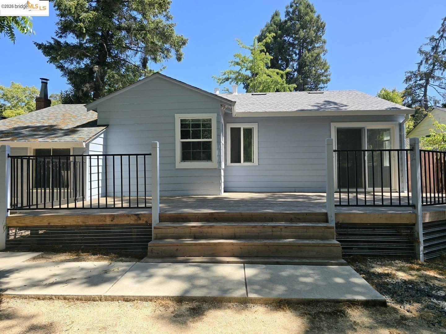 241 Humboldt Street San Rafael, CA 94901 - Photo 27 of 32 a backyard of a house with barbeque oven and outdoor seating