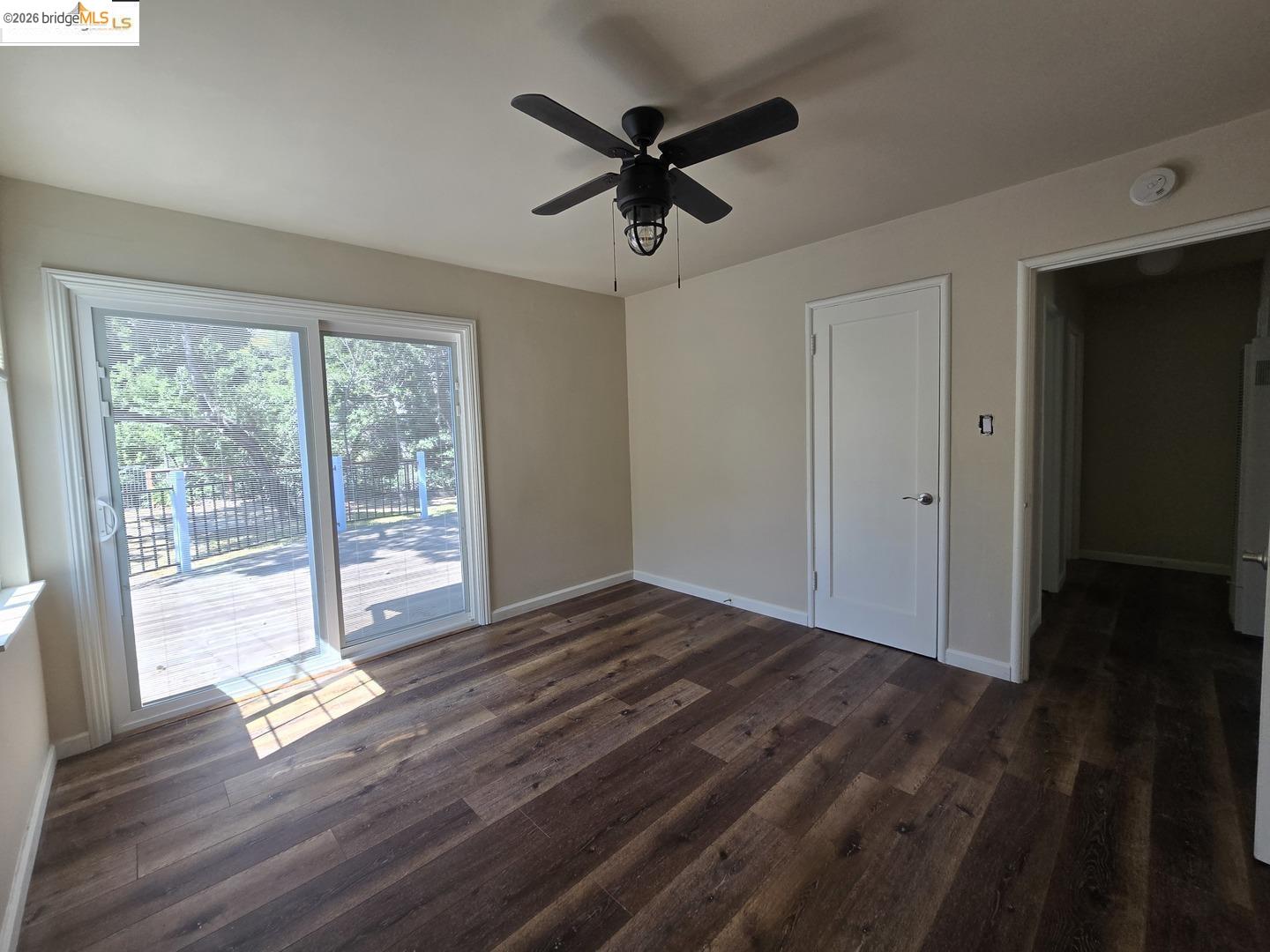241 Humboldt Street San Rafael, CA 94901 - Photo 6 of 32 a view of room with wooden floor and a ceiling fan