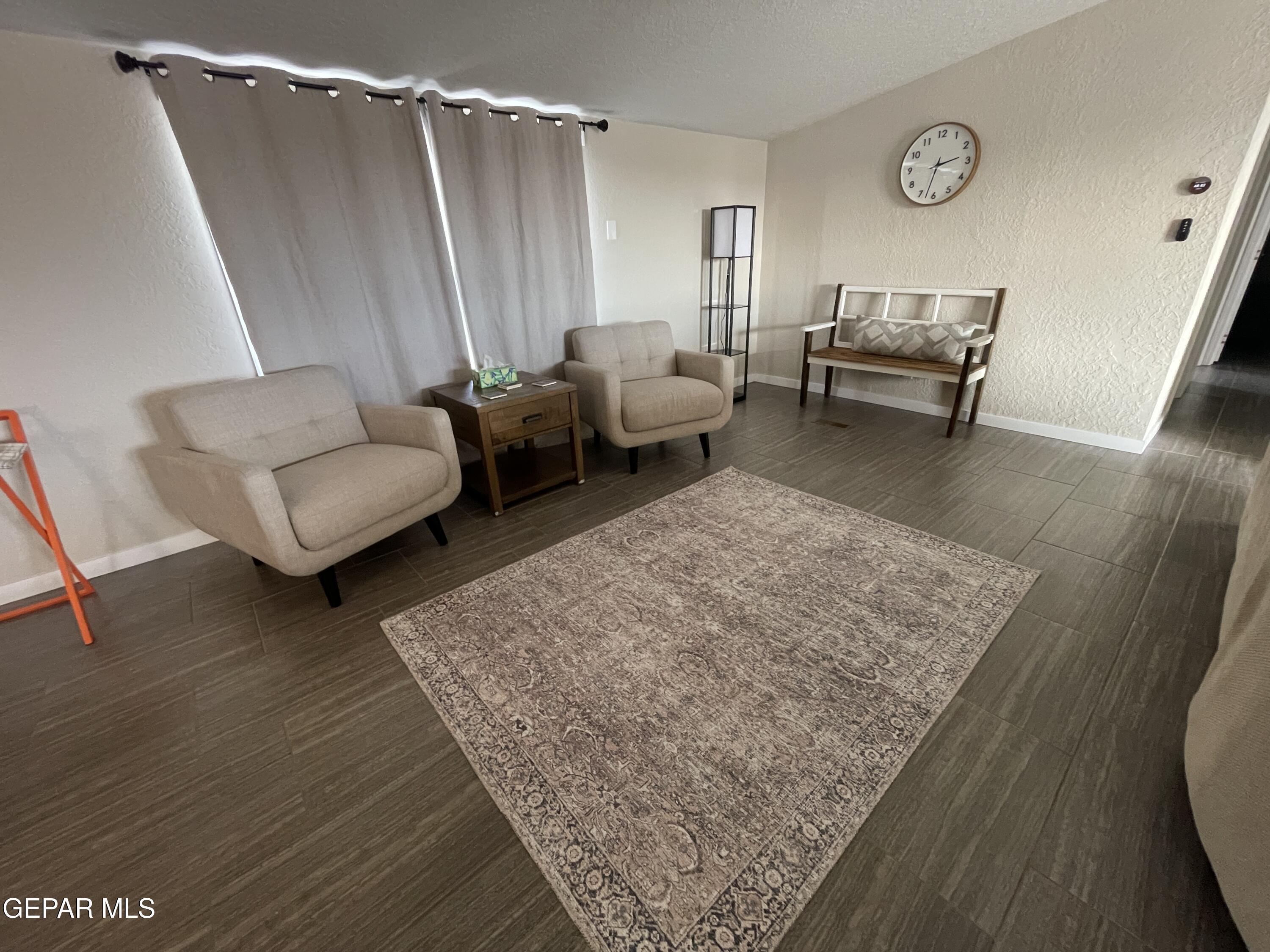 2901 Cook Street Truth Or Consequences, NM 87901 - Photo 8 of 28 a living room with furniture and a wooden floor